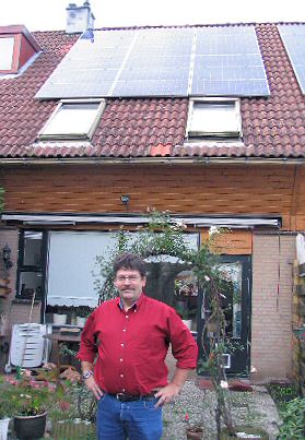 Ton Peters proudly showing "his" 2700 Wp PV-installation which is monitored continuously. 