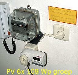 "end of pipe" monitoring of cumulative energy yield of 108 Wp group (total 648 Wp) with digital Energy Check meter (below) and second-hand one-phase analog meter (above) before feeding into the net